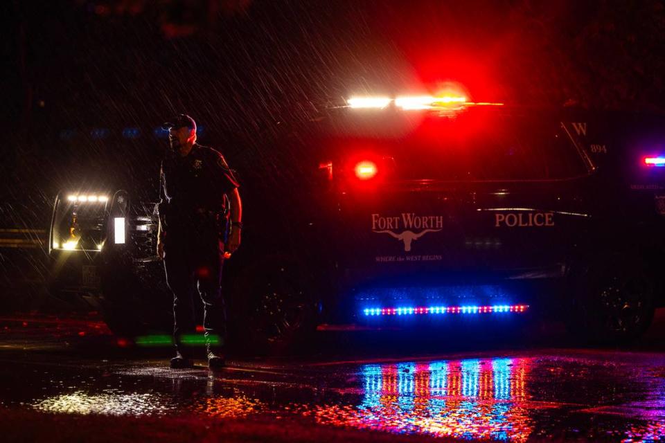 A Fort Worth Police Department officer closes a portion of W Vickery Boulevard due to flooding next to Collett Park in Fort Worth on Wednesday October. 4, 2023.