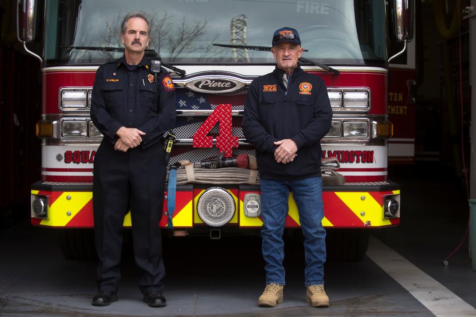 Retired senior Wilmington firefighter William Kirlin Jr., right, and current Wilmington Fire Department Battalion Chief Dennis Kirlin stand for a portrait Friday, Nov. 26, 2021. 