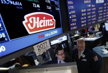 Traders work at the post that trades H.J. Heinz Co. on the floor of the New York Stock Exchange, February 14, 2013. REUTERS/Brendan McDermid