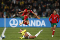Morocco's Hanane Ait El Haj, right, watches as Colombia's Manuela Vanegas, down, challenges Morocco's Sakina Ouzraoui during the Women's World Cup Group H soccer match between Morocco and Colombia in Perth, Australia, Thursday, Aug. 3, 2023. (AP Photo/Gary Day)