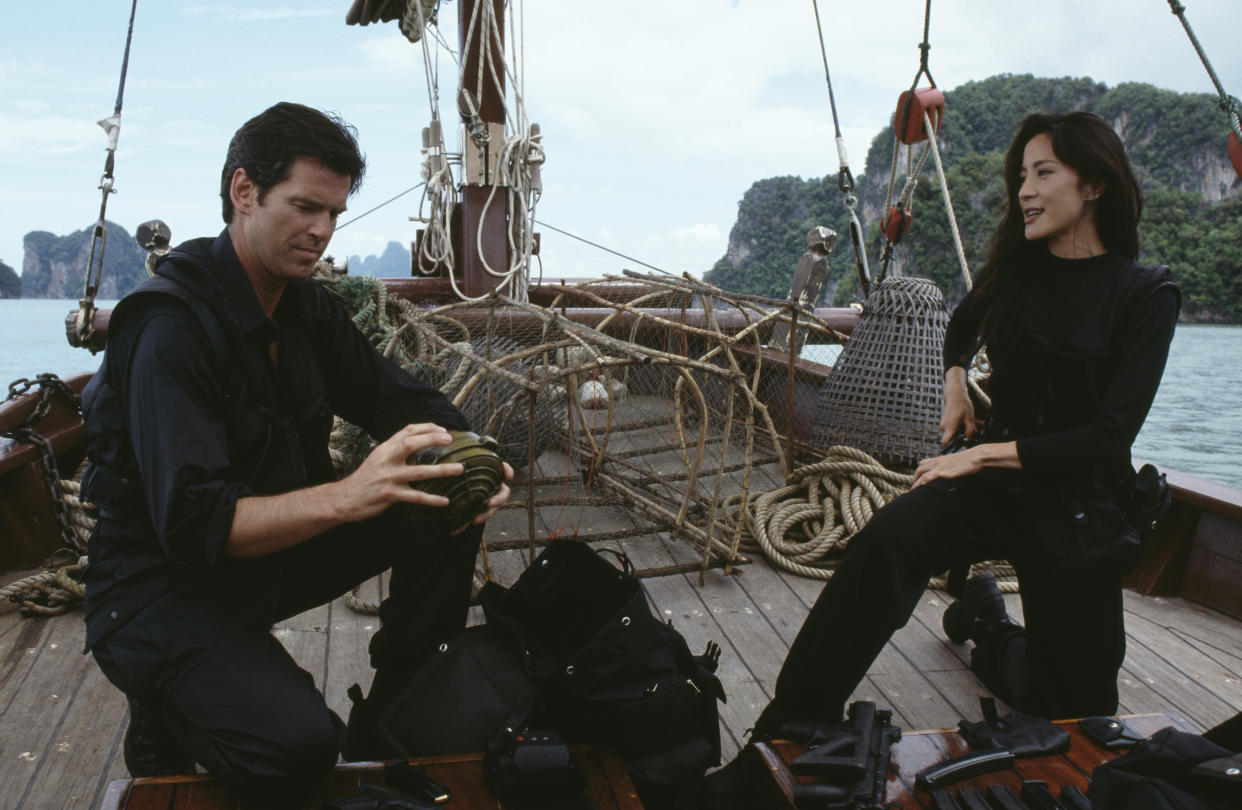 Irish actor Pierce Brosnan as 007 with Malaysian actress Michelle Yeoh as Wai Lin, on location in Thailand for the James Bond film 'Tomorrow Never Dies', 1997. (Photo by Keith Hamshere/Getty Images) 