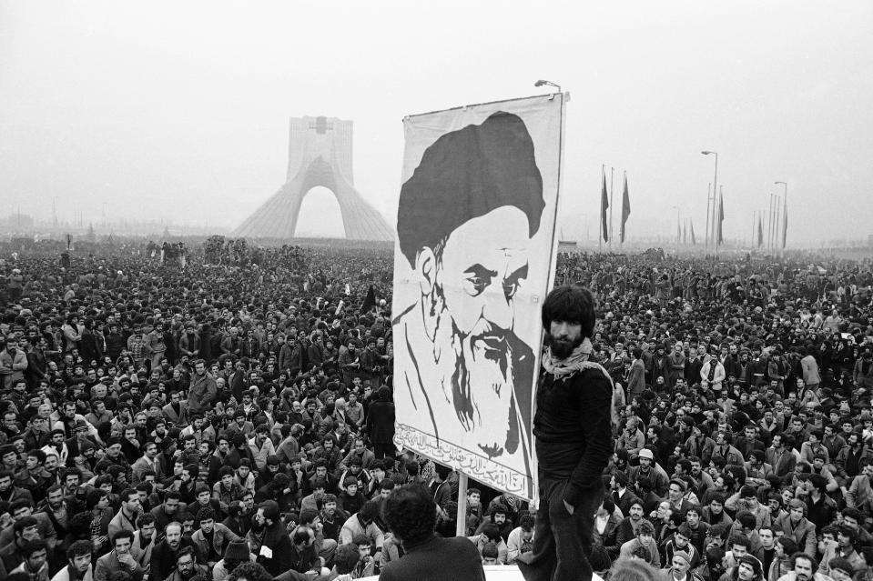 FILE - In this Dec. 10, 1978 file photo, demonstrators hold up a poster of exiled Muslim leader Ayatollah Ruhollah Khomeini during an anti-shah demonstration in Tehran, Iran. monument. Iran’s Islamic Revolution changed a stalwart U.S. ally into a regional adversary. This climactic event and others in 1979, which dominated television sets and newspaper front pages 40 years ago, helped shape the modern Middle East. (AP Photo/Michel Lipchitz, File)