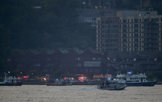 <p>Search and rescue boats look for a small plane that went down in the Hudson River, Friday, May 27, 2016. A World War II vintage P-47 Thunderbolt aircraft crashed into the river Friday, May 27 killing its pilot. (AP Photo/Julie Jacobson) </p>