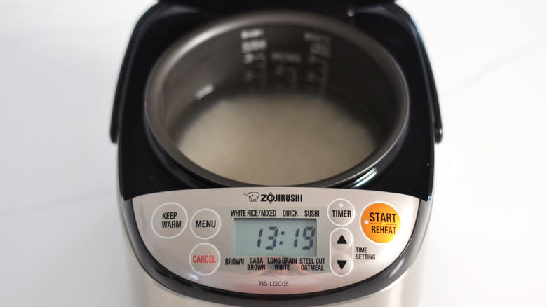 Rice soaking in water in rice cooker