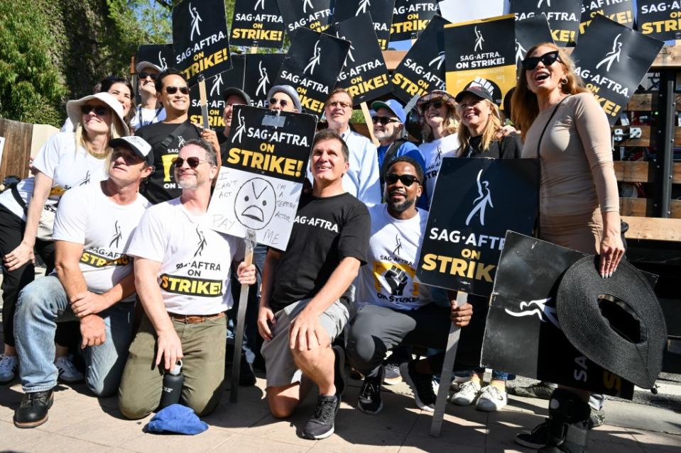 Joshua Malina, Bradley Whitford, Aaron Sorkin and the cast of The West Wing at the SAG-AFTRA and WGA strike at Disney Studios on August 22, 2023 in Burbank, California.