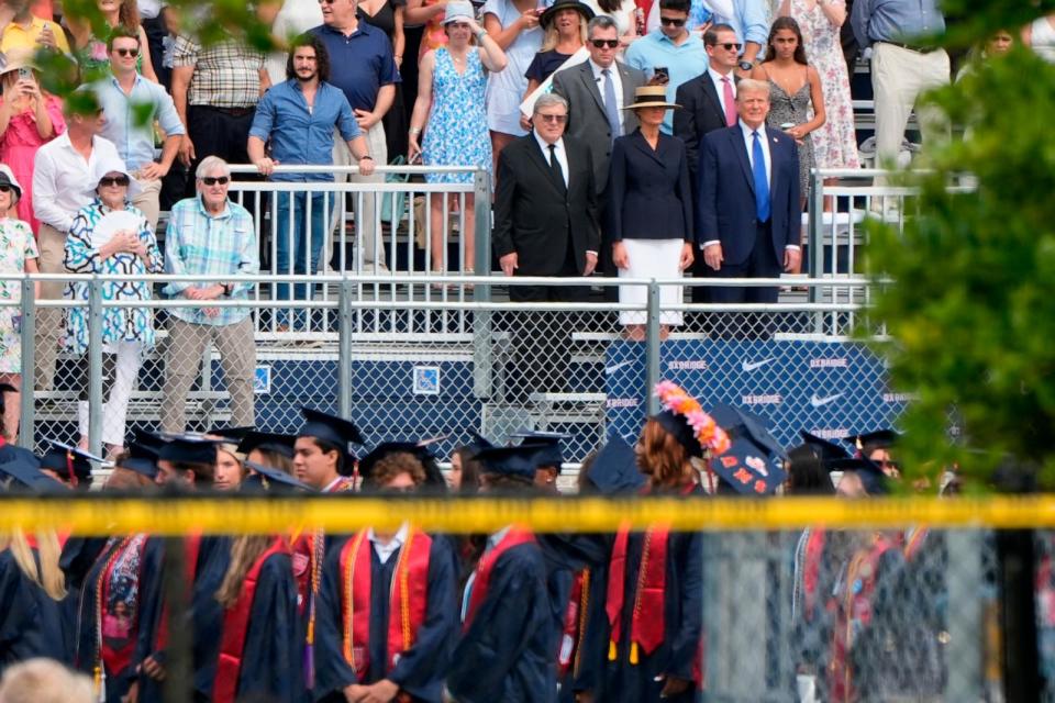 PHOTO: Republican presidential candidate former President Donald Trump, standing right with Melania Trump and her father, Viktor Knavs, attends a graduation ceremony for his son Barron at Oxbridge Academy, May 17, 2024, in West Palm Beach, Fla. (Lynne Sladky/AP)