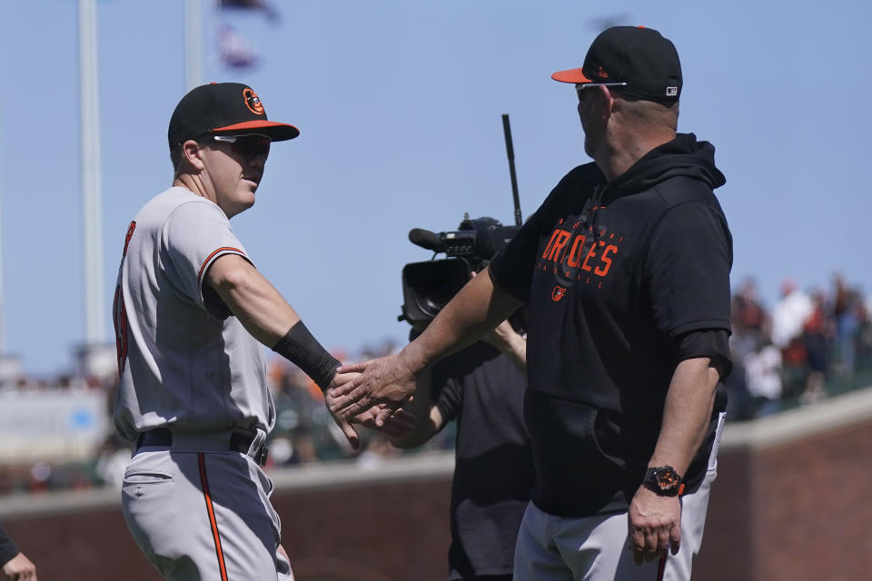 Baltimore Orioles' Josh Lester, left, celebrates with manager Brandon Hyde after they defeated the San Francisco Giants in a baseball game in San Francisco, Sunday, June 4, 2023. (AP Photo/Jeff Chiu)