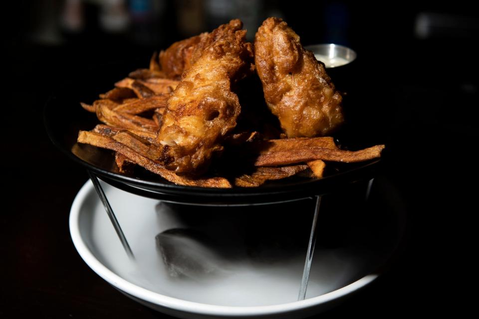 The fish and chips from The Cauldron are presented atop a cloud of smoke.