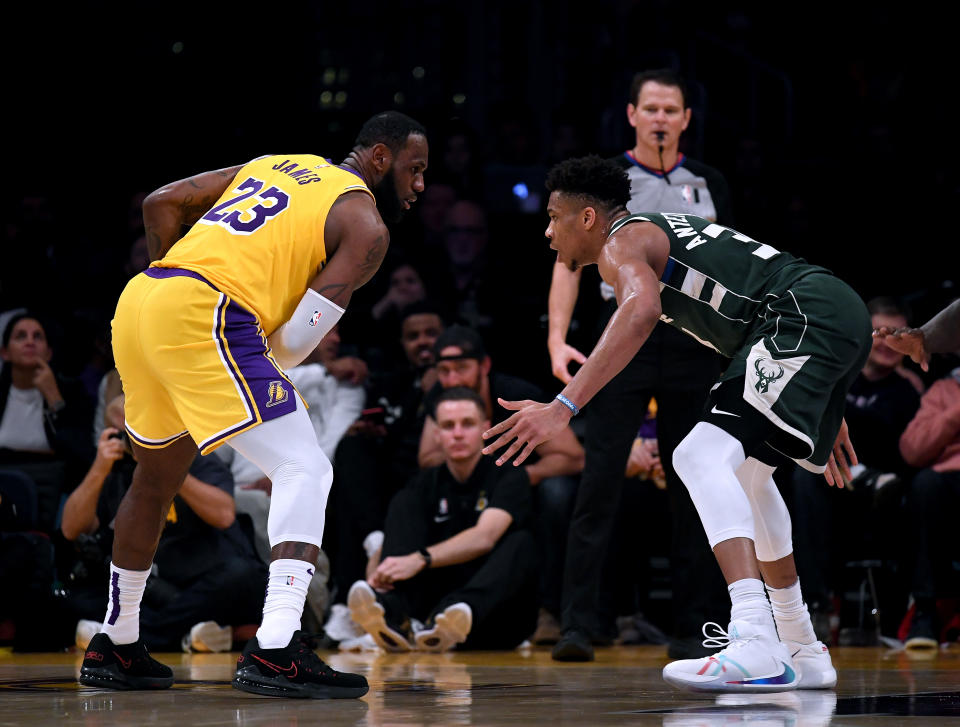 LeBron James and Giannis Antetokounmpo will almost certainly headline the NBA's top-seeded playoff teams. (Harry How/Getty Images)