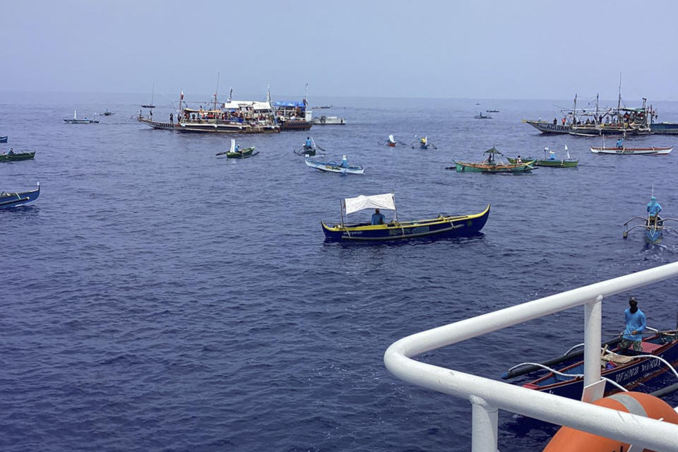 In this photo provided by the Philippine Coast Guard, fishing boats carrying activists and volunteers belonging to a nongovernment coalition called Atin Ito, Tagalog for This is Ours, pass by waters off Palauig Point, Zambales province, northwestern Philippines as they head towards Scarborough Shoal on Wednesday May 15, 2024. A flotilla of about 100 mostly small fishing boats led by Filipino activists sailed Wednesday to a disputed shoal in the South China Sea, where Beijing's coast guard and suspected militia ships have used powerful water cannons to ward off what they regard as intruders. (Philippine Coast Guard via AP)