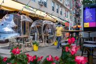 Bubble tents are set up outside Cafe Du Soliel following the outbreak of the coronavirus disease (COVID-19) in the Manhattan borough of New York City