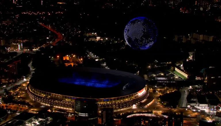 23-07-2021 Drones en el cielo de Tokio formando el planeta Tierra POLITICA INVESTIGACIÓN Y TECNOLOGÍA JUEGOS OLÍMPIOS TOKIO 2020