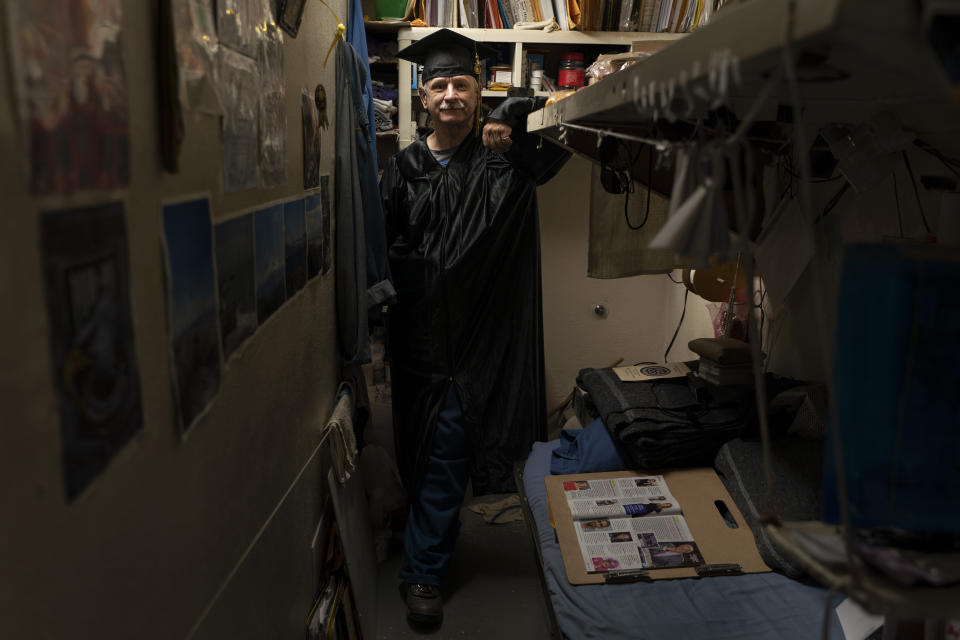 Leroy Dehaven, who earned a bachelor's degree in communications through the Transforming Outcomes Project at Sacramento State (TOPSS), stands for a portrait in his cell after a graduation ceremony at Folsom State Prison in Folsom, Calif., Thursday, May 25, 2023. (AP Photo/Jae C. Hong)