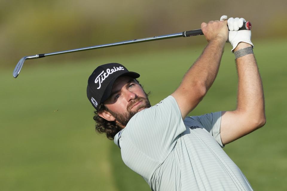 Cameron Young of the U.S. plays his second shot on the 14th hole during the third round of the Hero Dubai Desert Classic golf tournament, in Dubai, United Arab Emirates, Saturday, Jan. 20, 2024. (AP Photo/Kamran Jebreili)