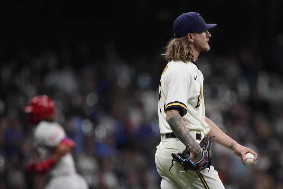 Milwaukee Brewers' Josh Hader, right, waits fter giving up a home run as Philadelphia Phillies' Alec Bohm runs the bases during the ninth inning of a baseball game Tuesday, June 7, 2022, in Milwaukee. (AP Photo/Aaron Gash)
