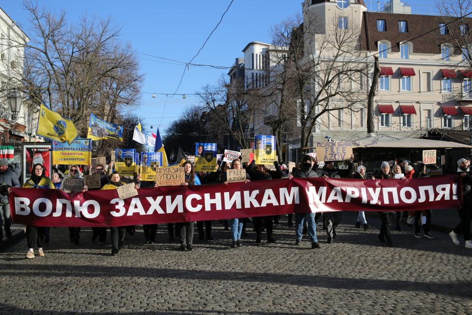 Protesters in Odessa, Ukraine, on December 23, 2023, hold a banner reading "Freedom for the defenders of Mariupol."