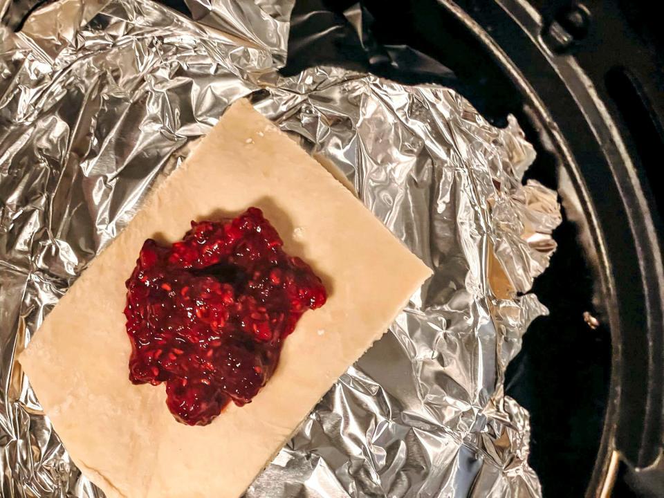 piece of puff pastry with berry compote on top