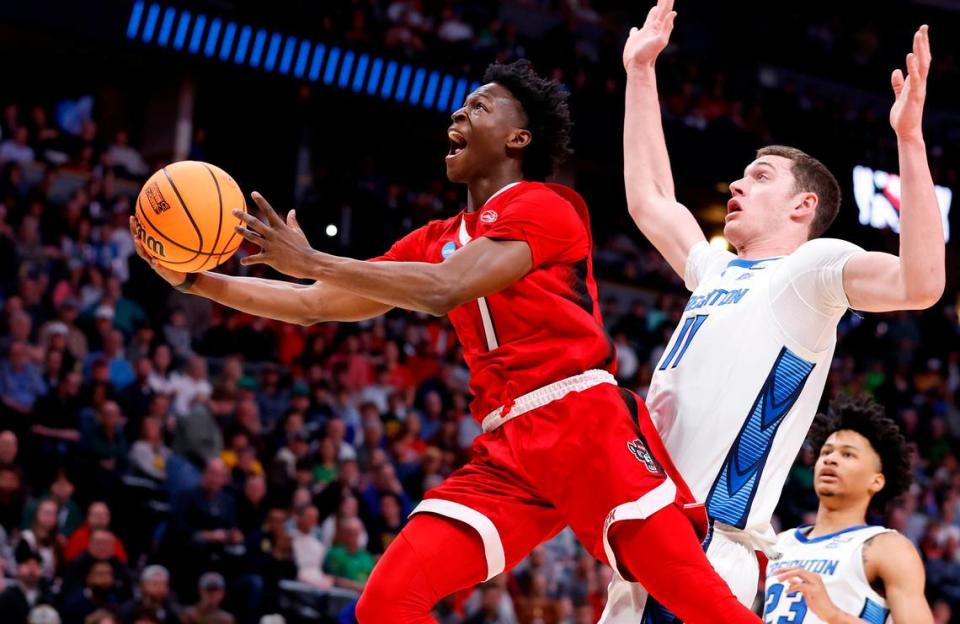 N.C. State’s Terquavion Smith (0) heads to the basket past Creighton’s Ryan Kalkbrenner (11) during the first half of N.C. State’s game against Creighton in the first round of the NCAA Tournament at Ball Arena in Denver, Colo., Friday, March 17, 2023. Ethan Hyman/ehyman@newsobserver.com