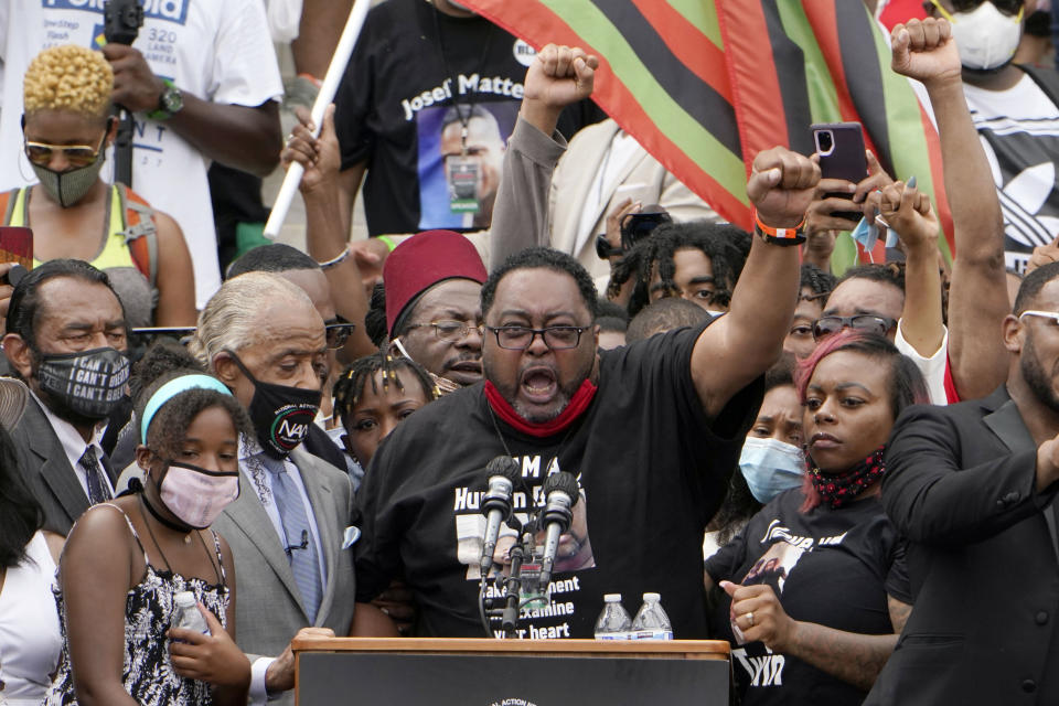 Jacob Blake Sr., father of Jacob Blake, raises his fist in the air while speaking at the March on Washington, Friday Aug. 28, 2020, at the Lincoln Memorial in Washington. (AP Photo/Jacquelyn Martin, Pool)