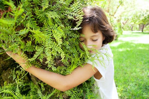 <span class="caption">The environmental cost of childbearing is central to climate ethics debates.</span> <span class="attribution"><a class="link " href="https://www.shutterstock.com/image-photo/child-girl-hugging-mature-organic-textured-1543545884" rel="nofollow noopener" target="_blank" data-ylk="slk:MJTH/Shutterstock">MJTH/Shutterstock</a></span>