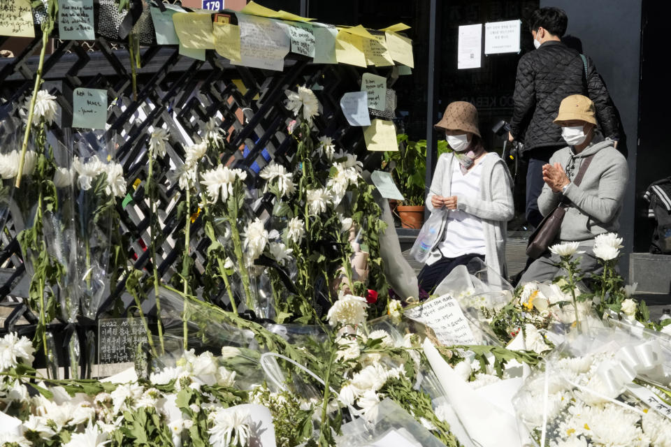 People pray for victims of a deadly accident during Halloween festivities in Seoul, South Korea, on Nov. 2, 2022. (Ahn Young-joon / AP)