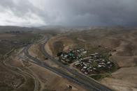 A view of the Bedouin hamlet of Khan al-Ahmar in the West Bank, Tuesday, Jan. 31, 2023. The long-running dispute over the West Bank Bedouin community of Khan al-Ahmar, which lost its last legal protection against demolition four years ago, resurfaced this week as a focus of the frozen Israeli-Palestinian conflict. Israel's new far-right ministers vow to evacuate the village as part of a wider project to expand Israeli presence in the 60% of the West Bank over which the military has full control. Palestinians seek that land for a future state. (AP Photo/Oded Balilty)