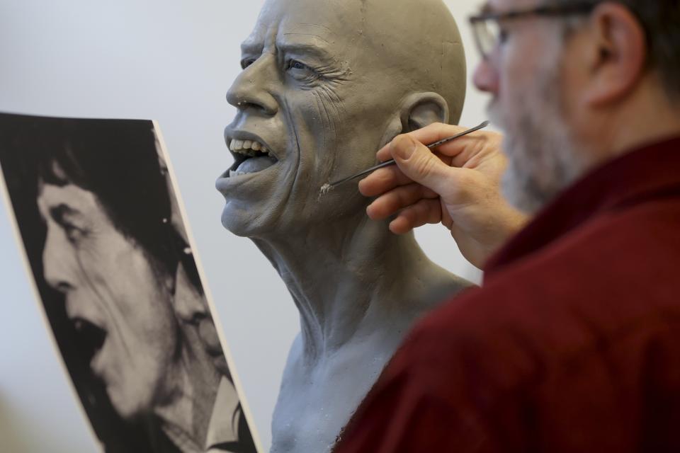 Paris' Grevin Wax Museum sculptor Eric Saint Chaffray works on the head of Rolling Stones lead singer Mick Jagger at their workshop in Paris