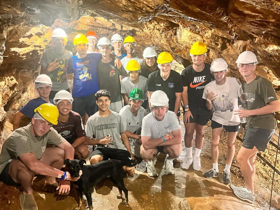 Booker T. Washington boys soccer team players pose for a picture at a gold mine in Brazil over Thanksgiving break during "The Brazilian Soccer Experience."