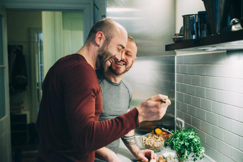 A couple making food together