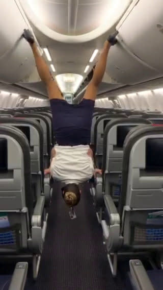 This flight attendant shows off her remarkable acrobatic skills to close the overhead bins with her feet - while wearing high heels. Lindsey O'Brien, 35, gripped onto the armrests before flipping upside down and using her feet to close four luggage containers above. She twirled back down to the aisle and lifted her arms in triumph as her fellow crew members cheered her on. The video was filmed in June aboard an aircraft which had been grounded in her home city of Philadelphia, Pennsylvania, due to Covid-19.