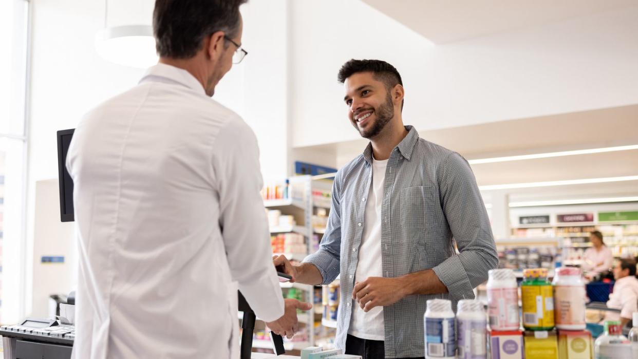 man buying medicines at the pharmacy