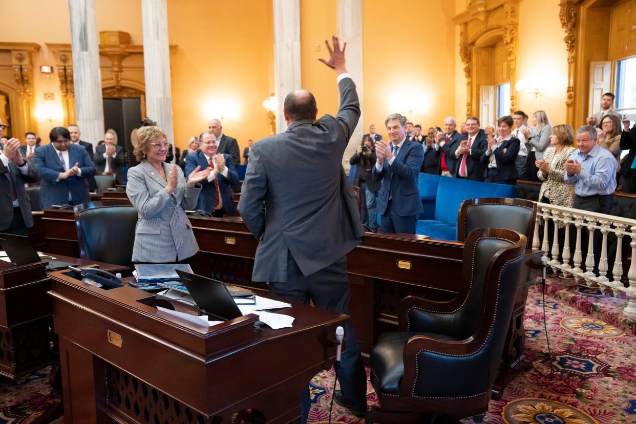 Dec 14, 2022; Columbus, OH, USA;  Ohio Senator Jay Hottinger from Newark waves his hands after receiving a standing ovation during a tribute for his decades of public service in the Senate Chambers. Mandatory Credit: Brooke LaValley/Columbus Dispatch