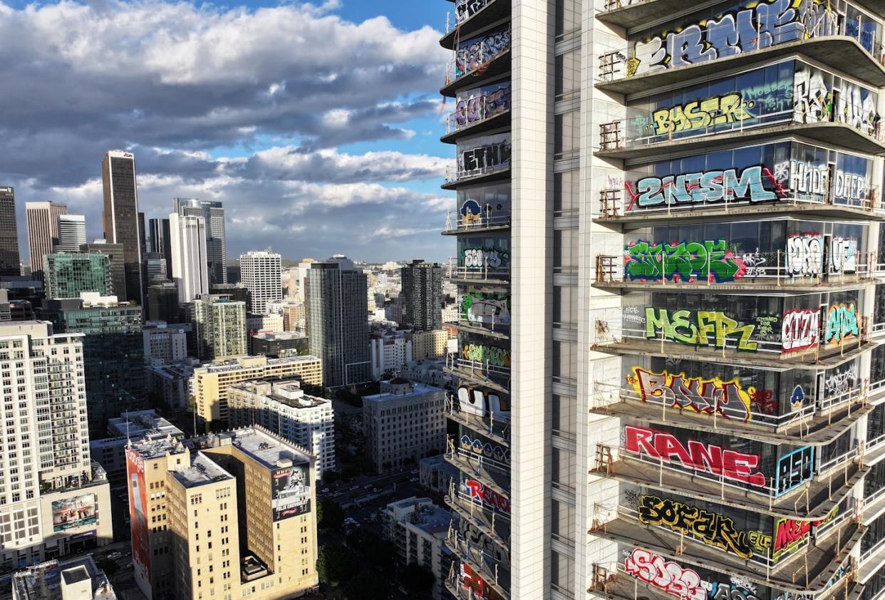 Construction of Oceanwide Plaza in downtown Los Angeles stalled in 2019 after the China-based developer ran out of funding. <a href="https://www.gettyimages.com/detail/news-photo/an-aerial-view-of-graffiti-spray-painted-by-taggers-on-at-news-photo/1981900572?adppopup=true" rel="nofollow noopener" target="_blank" data-ylk="slk:Mario Tama/Getty Images;elm:context_link;itc:0;sec:content-canvas" class="link ">Mario Tama/Getty Images</a>