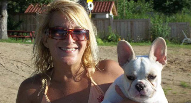 Lisa Urso, 52, pictured with a French Bulldog.