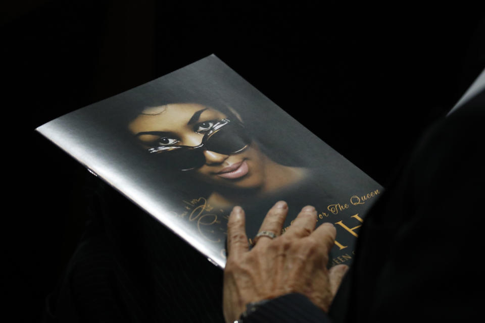 A person holds a program during the funeral service for Aretha Franklin at Greater Grace Temple, Friday, Aug. 31, 2018, in Detroit. Franklin died Aug. 16, 2018 of pancreatic cancer at the age of 76. (AP Photo/Paul Sancya)