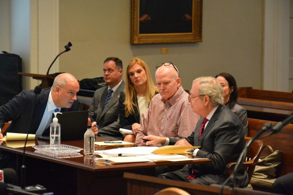 Alex Murdaugh confers with his legal team during a recent hearing on double murder charges in Colleton County.