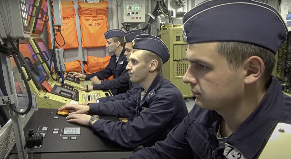 In this photo taken from video provided by the Russian Defense Ministry Press Service on Wednesday, Feb. 16, 2022, a Russian navy's team at work during naval exercises in the Mediterranean. Russia's naval drills in the Mediterranean come amid the tensions with the West over Ukraine. (Russian Defense Ministry Press Service via AP)
