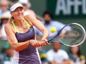 Maria Sharapova of Russia plays a backhand in her Women's Singles Final match against Serena Williams of United States of America during day fourteen of French Open at Roland Garros on June 8, 2013 in Paris, France.