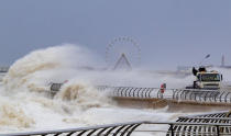 Waves crash over a lorry on Blackpool waterfront on Monday in the aftermath of Storm Ciara. (PA)