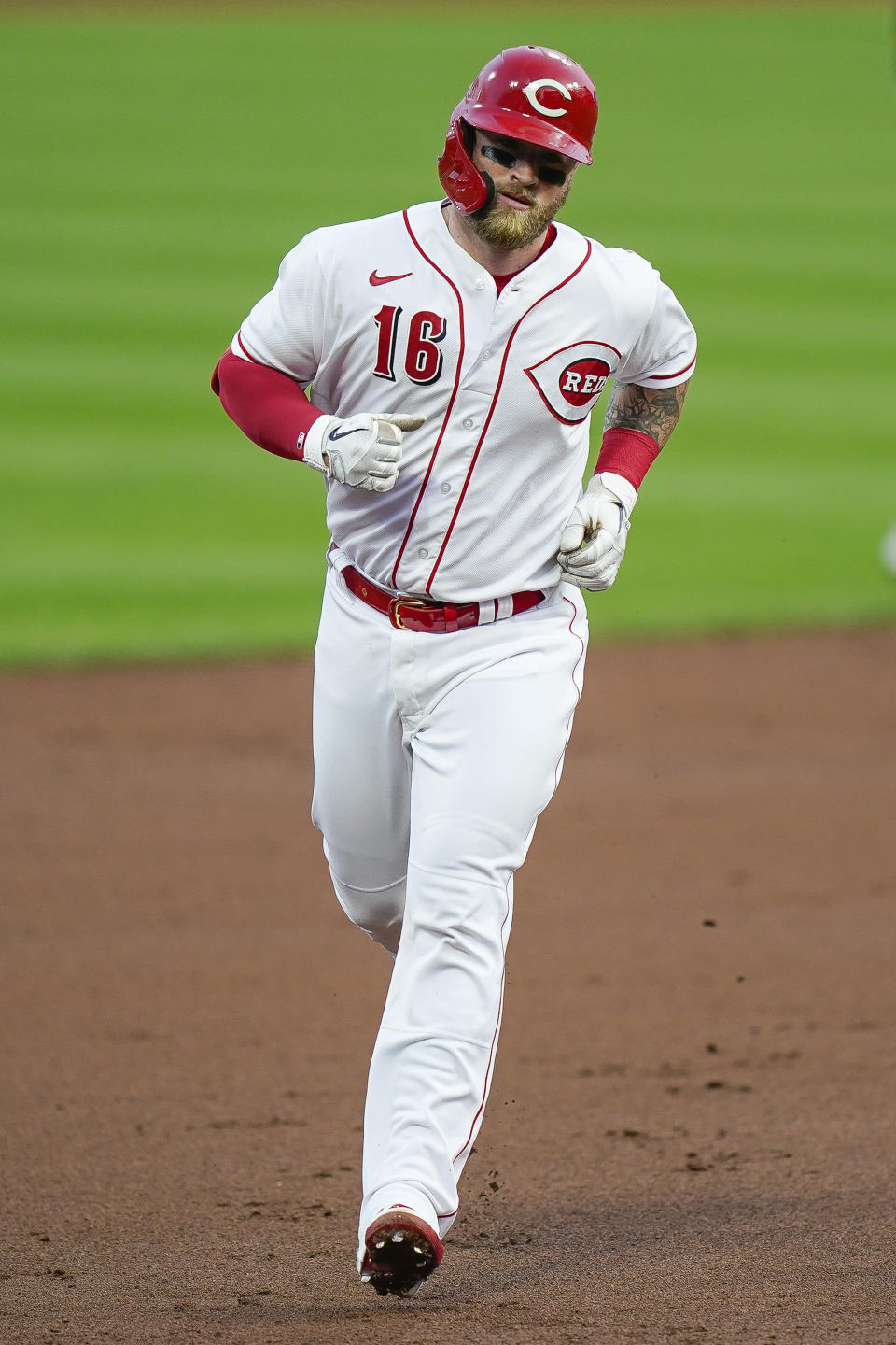Cincinnati Reds' Tucker Barnhart runs the bases after hitting a home run during the second inning of the team's baseball game against the Pittsburgh Pirates in Cincinnati, Tuesday, Sept. 15, 2020. (AP Photo/Bryan Woolston)