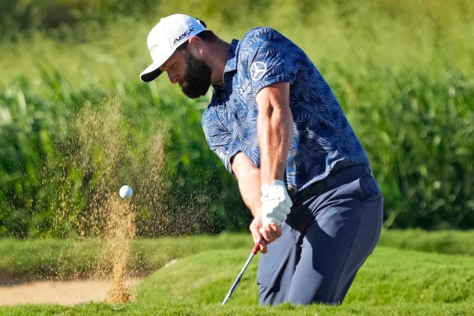 Low scores were abound in the first round of the Sentry Tournament of Champions in Hawaii, with Jon Rahm, Collin Morikawa and JJ Spaun all sharing the lead on nine under par (Matt York/AP) (AP)