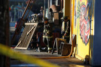 Firefighters exit a warehouse where a fire broke out during an electronic dance party late Friday evening, resulting in at least nine deaths and many unaccounted for in the Fruitvale district of Oakland, California, U.S. December 3, 2016. REUTERS/Stephen Lam