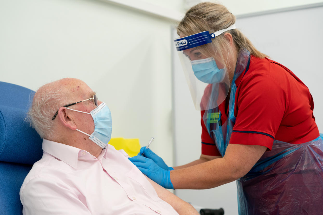 General manager of Covid Recovery Becky Board administers the hospital's first Pfizer-BioNTech Covid-19 vaccine to George Dyer, 90, in The Vaccination Hub at Croydon University Hospital, south London, on the first day of the largest immunisation programme in the UK's history. Care home workers, NHS staff and people aged 80 and over began receiving the jab this morning.