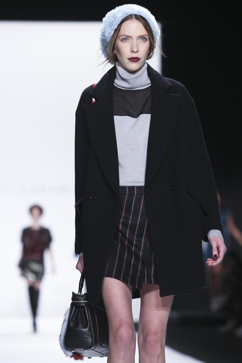 The Rebecca Minkoff Fall 2014 collection is modeled during Fashion Week, Friday, Feb. 7, 2014, in New York. (AP Photo/John Minchillo)