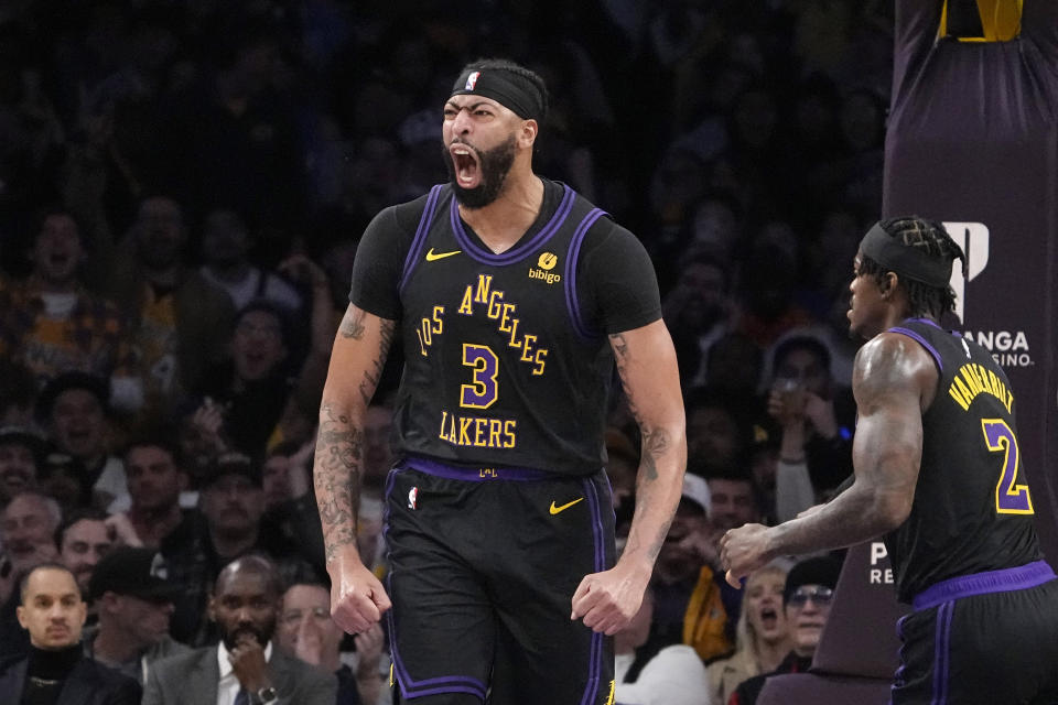 Los Angeles Lakers forward Anthony Davis celebrates after scoring during the first half of an NBA basketball game against the Oklahoma City Thunder Monday, Jan. 15, 2024, in Los Angeles. (AP Photo/Mark J. Terrill)