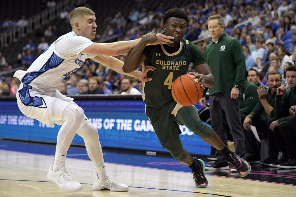 Colorado State guard Isaiah Stevens (4) is pressured by Creighton guard Baylor Scheierman (55) during the second half of an NCAA college basketball game Thursday, Nov. 23, 2023, in Kansas City, Mo. Colorado State won 69-48. (AP Photo/Charlie Riedel)