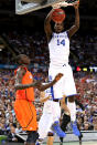 NEW ORLEANS, LA - MARCH 31: Michael Kidd-Gilchrist #14 of the Kentucky Wildcats dunks the ball next to Gorgui Dieng #10 of the Louisville Cardinals in the second half during the National Semifinal game of the 2012 NCAA Division I Men's Basketball Championship at the Mercedes-Benz Superdome on March 31, 2012 in New Orleans, Louisiana. (Photo by Ronald Martinez/Getty Images)