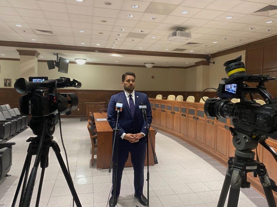 Jackson City Mayor Scott Conger speaks with reporters following a June special-called city council meeting.