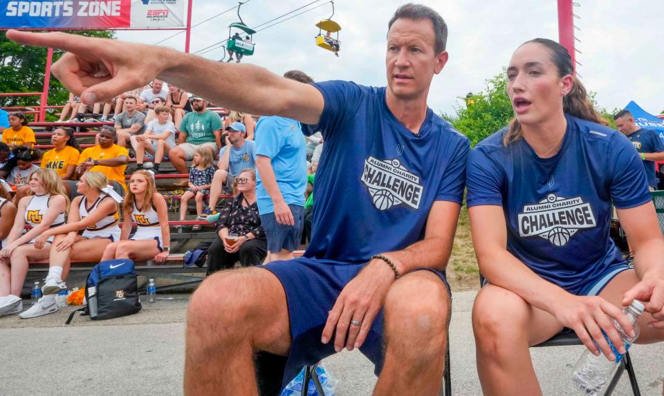 Marquette University alumni Steve Novak and Chloe Marotta strategize before the 2nd Alumni Charity Challenge at Summerfest on Friday. The event raised funds for four charitable organizations: Garding Against Cancer, Autism Society of Southeastern Wisconsin, Nicole Ellis Foundation and the Boys & Girls Clubs of Greater Green Bay.