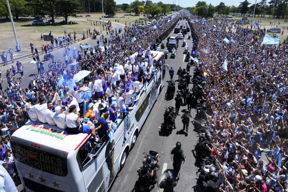 Captain Lionel Messi looks up during a homecoming parade for the Argentine soccer team that won the World Cup tournament against France, in Buenos Aires, Argentina, on Dec. 20, 2022. (AP Photo/Natacha Pisarenko)